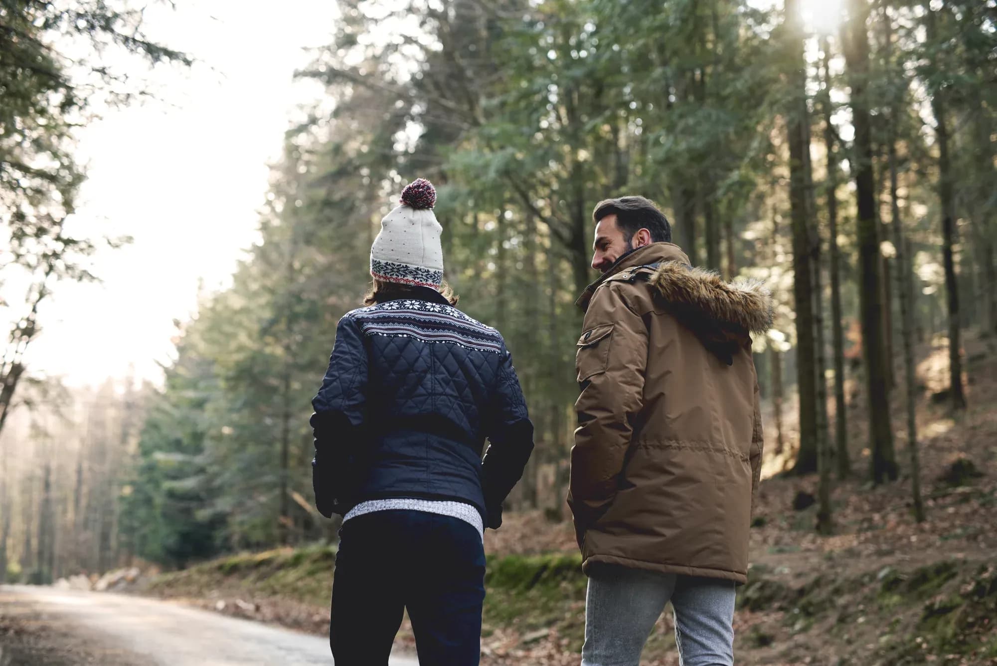rear-view-father-son-walking-autumn-forest