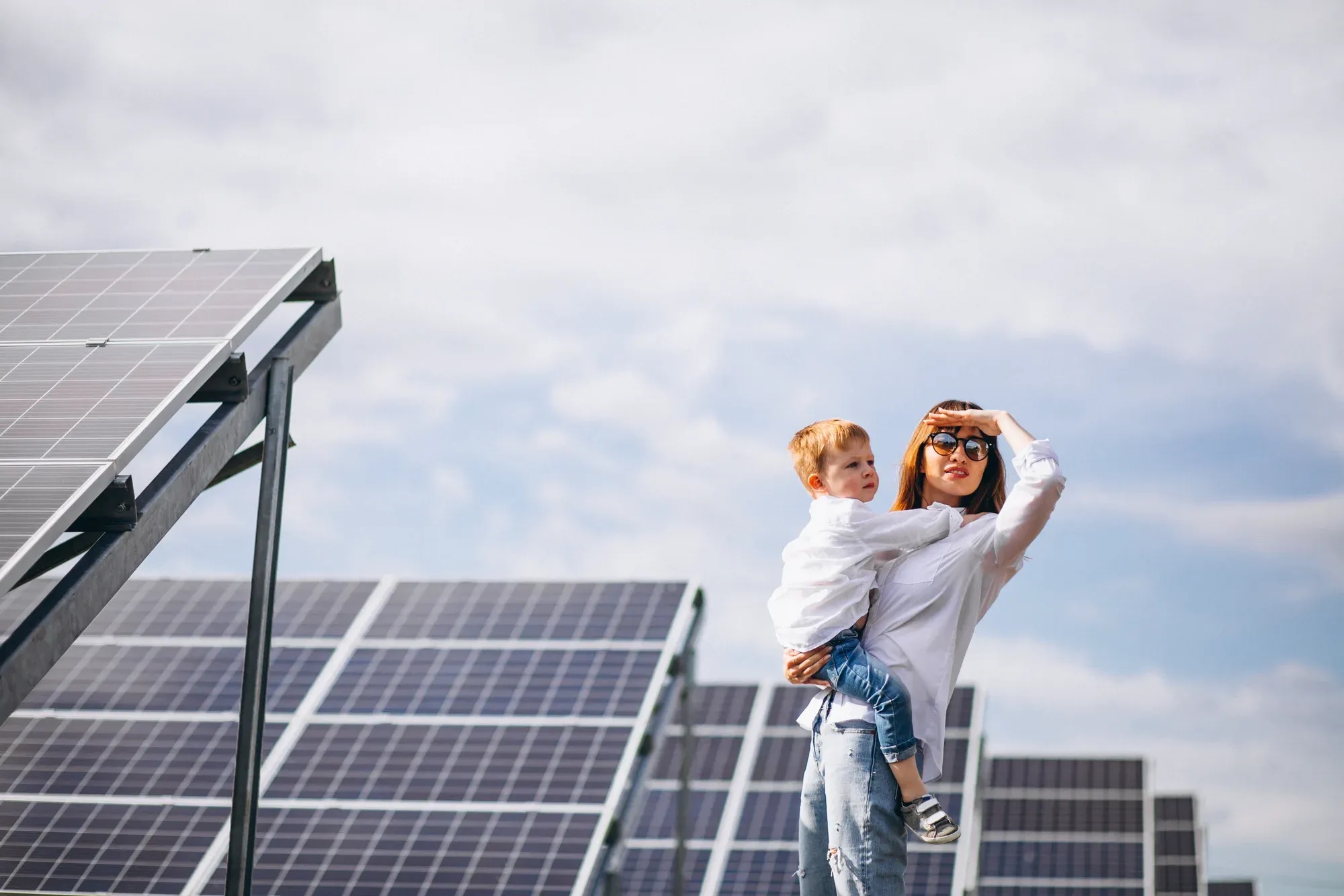 mother-with-her-little-son-by-solar-panels