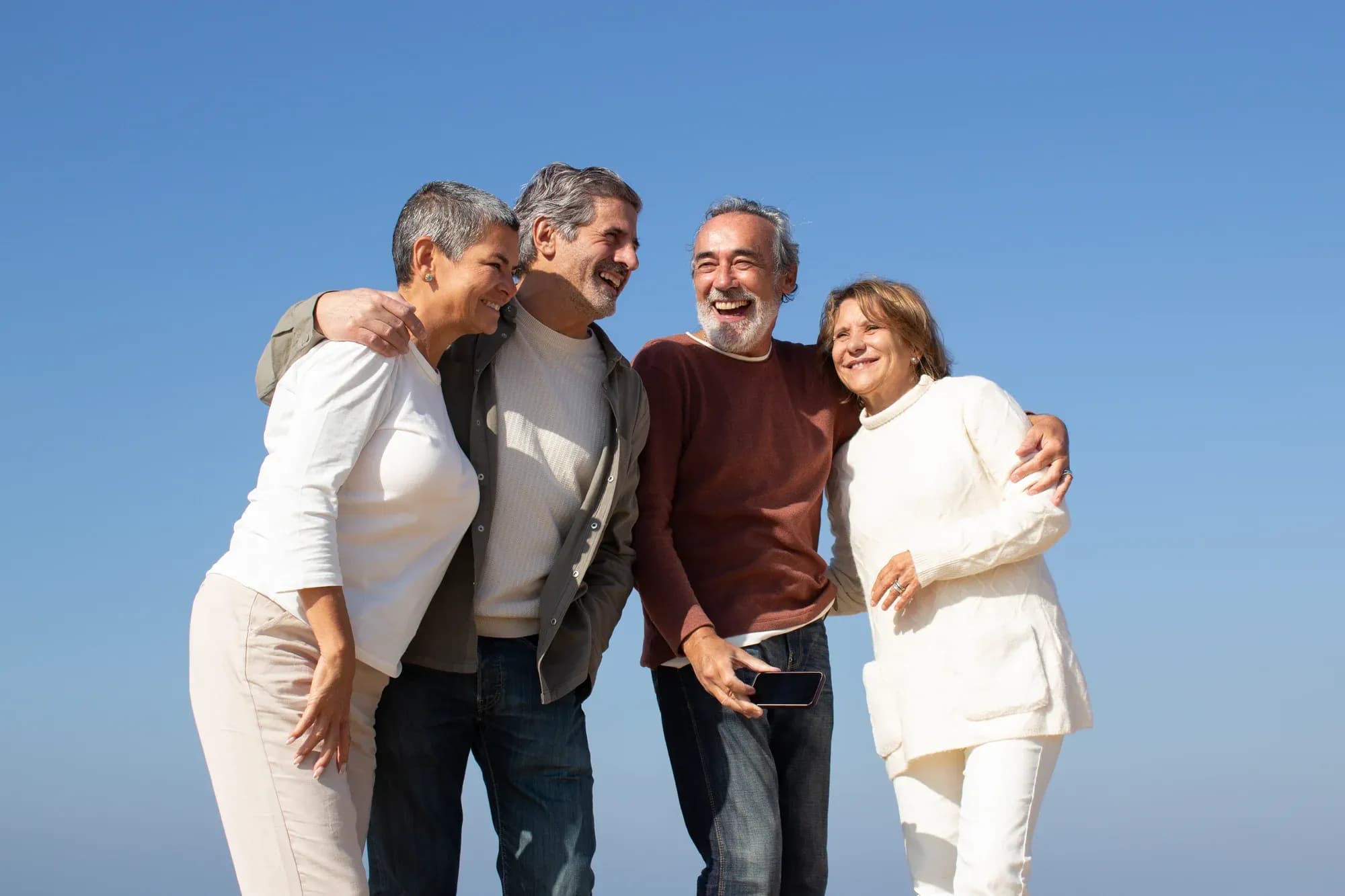 two-senior-couples-having-fun-outdoors-sunny-day-standing-against-blue-sky-laughing-happy-old-friends-enjoying-leisure-time