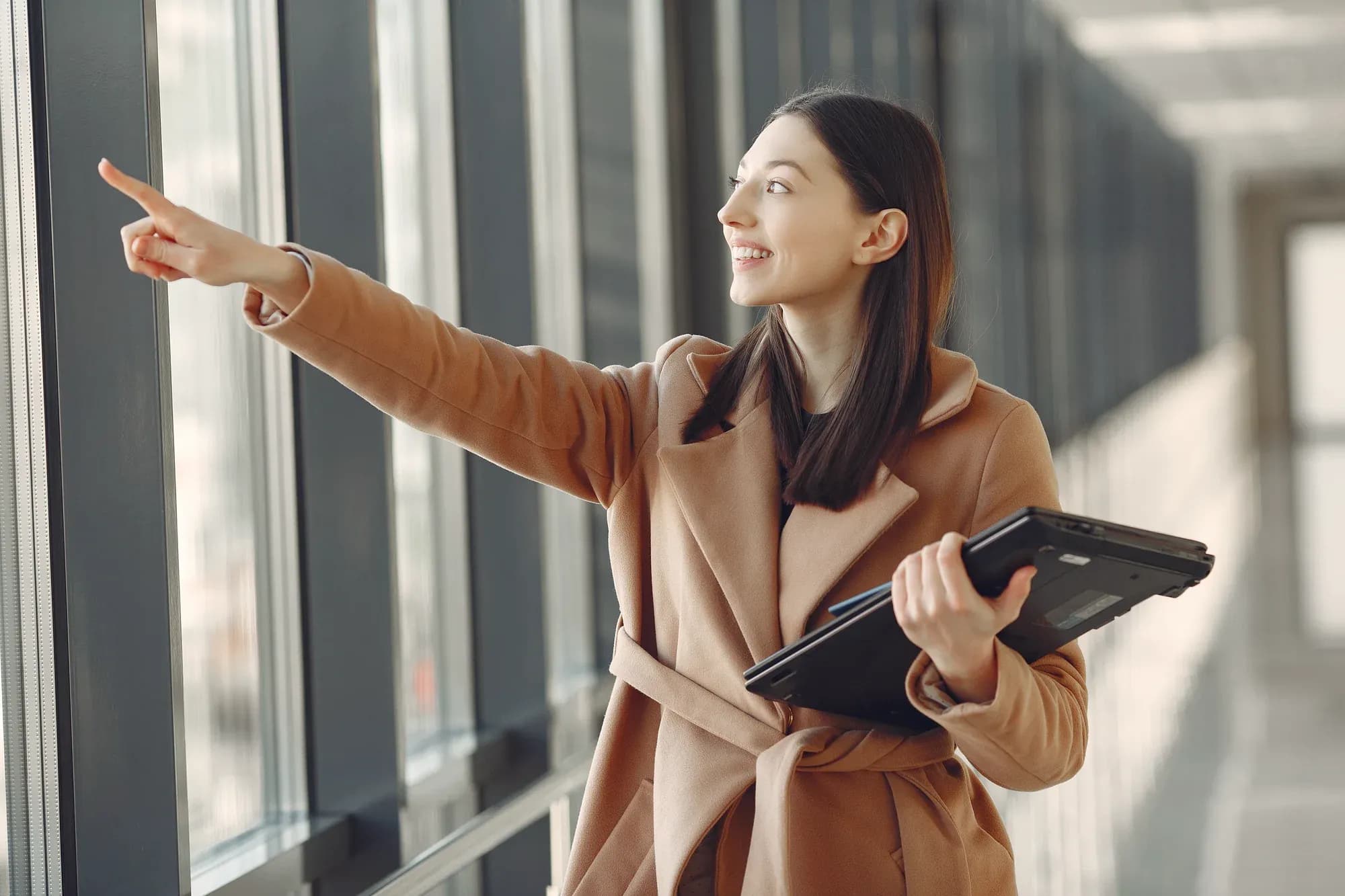 woman-standing-office-with-laptop