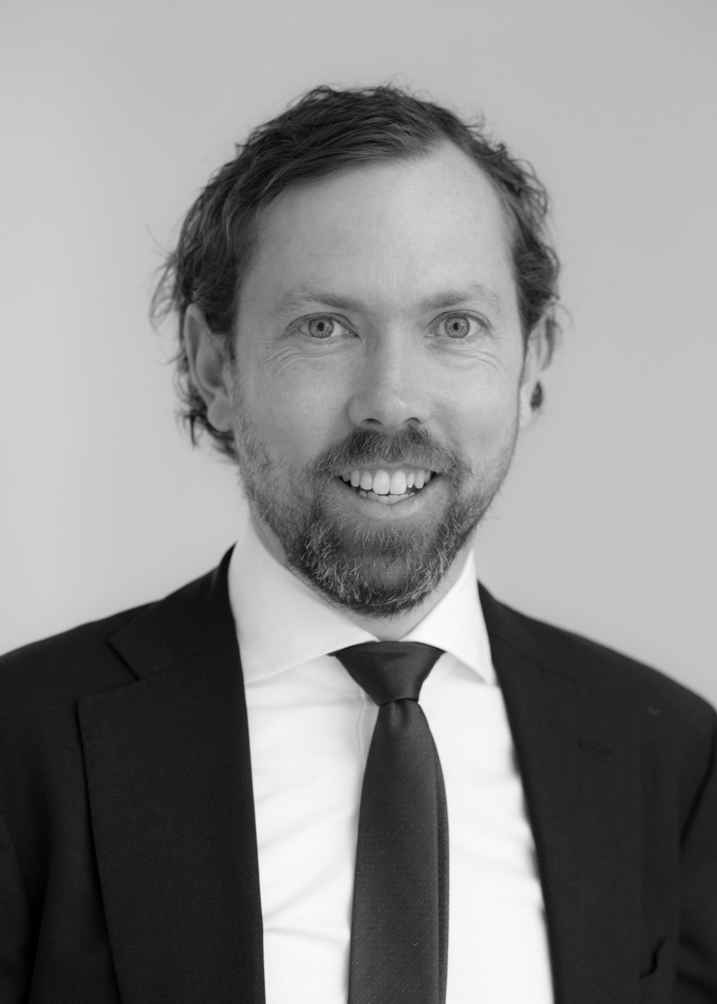 A black and white image of Tim Fitzpatrick, one of the financial advisers at Ethical Investment Services.