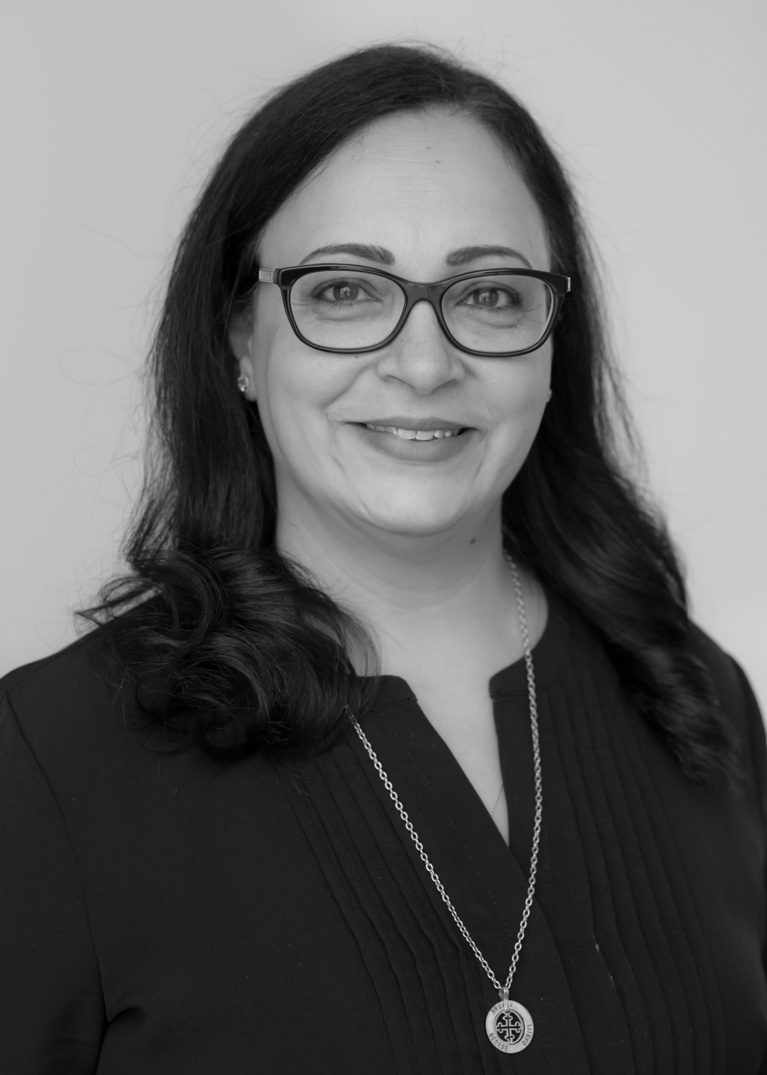 A black and white image of Amy Mikhael, Senior Paraplanner at Ethical Investment Services.