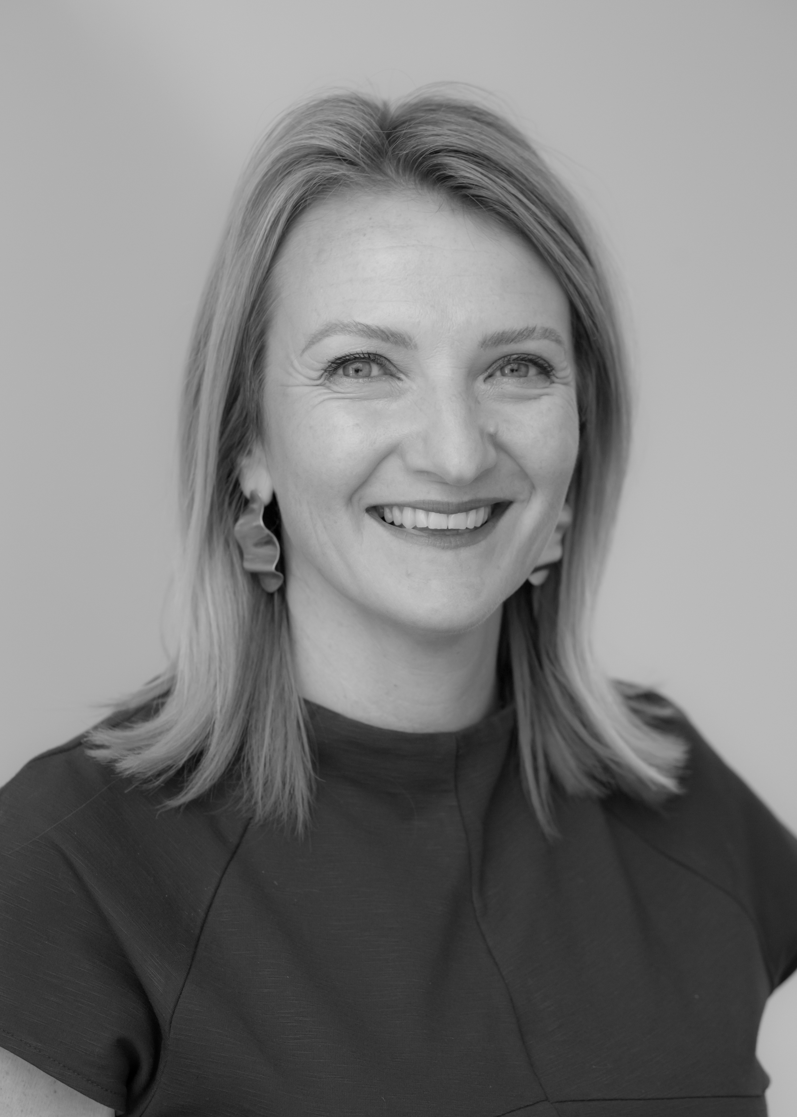 A black and white image of Andrea McKay, one of the financial advisers at Ethical Investment Services.